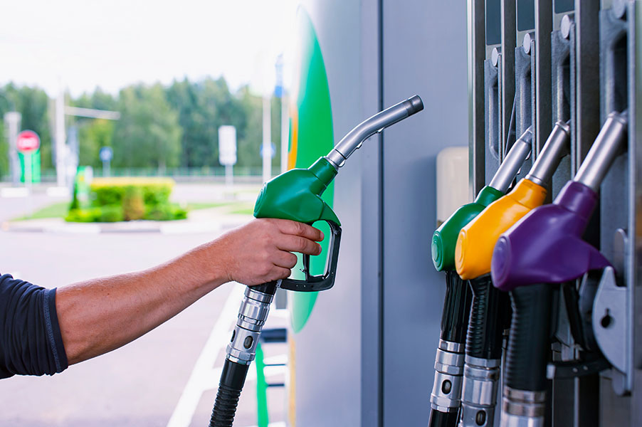 Man Holds A Refueling Gun In His Hand For Refueling